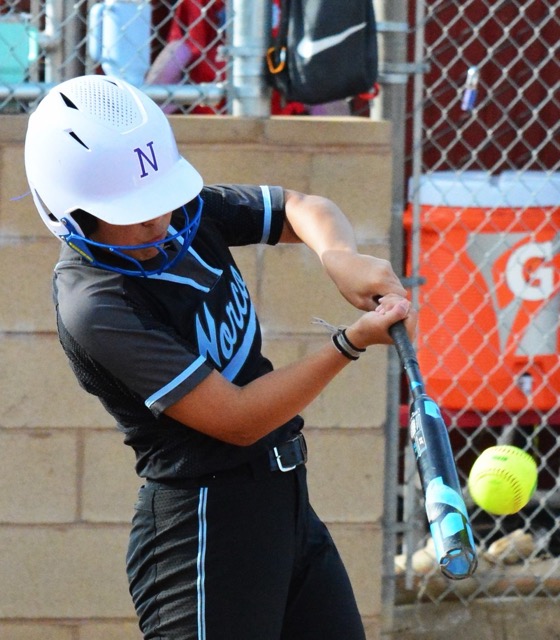  Norco’s Sasha Pham blasts a home run to left field during the Cougars 18 – 0 shutout of the Corona Panthers.