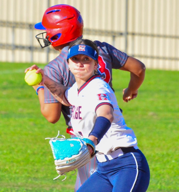 Heritage shortstop Morgan Martens (8) ignores the Corona runner behind her and throws to first base for the third out in the third inning of the Patriots’ victory over the Panthers.