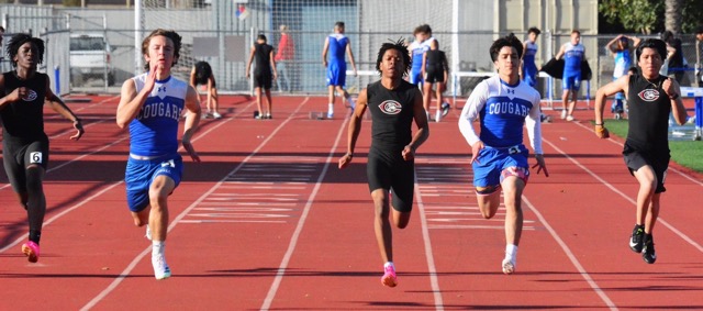 Corona Centennial’s Aidan Joshua (left), Andrew Alexander (center) and Ricardo Soto (right) and Norco’s Joseph Clay (mid left) and Manual Hernandez (mid right) are all running on air in the JV Boys 100 Meter race. Clay Prevailed.
Credit: Photo by Gary Evans
