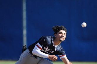 La Sierra second baseman Jose Pena can't make play on a pop fly in the second inning of a game against Norco in the Darryl Kile tournament at Norco Wednesday. The Cougars won, 11-1. Photo by Jerry Soifer