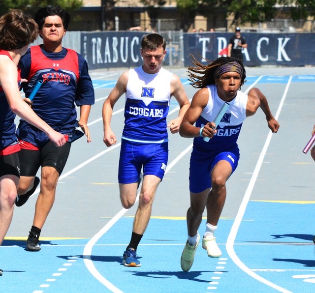 Norco’s Jayden Sheen hands the baton off to Akili Weusi during the CIF Unified and Diversified Boys 4 by 100 relay race.  Noah Varella previously handed to Sheen who passed to Weusi and the final leg was run by Kai Cephas.  The Cougars took third place.  