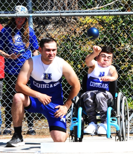 Norco’s Conner Hernandez (left) watches JR Brummier launch his shot put during the CIF Unified Track meet. JR’s mom Keri (left) looks on. Additional photos on Page 10. Credit: Photo by Gary Evans
