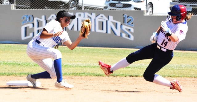 Norco’s Sasha Pham (left) is about to tag out Great Oak’s Chloe Koenigshofer (14) during the first inning of Tuesday’s first-round CIF Division 1 playoff game.  The Wolfpack defeated the Cougars 3 – 1 in 8 innings to advance.
Credit: Photo by Gary Evans
