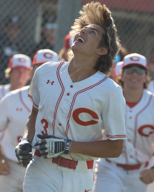 Corona's Billy Carlson exults as he celebrates his seventh-inning home run on Friday to defeat Placentia El Dorado, 1-0, in a CIF Div. 1 first-round playoff game at Corona. Credit: Photo by Jerry Soifer