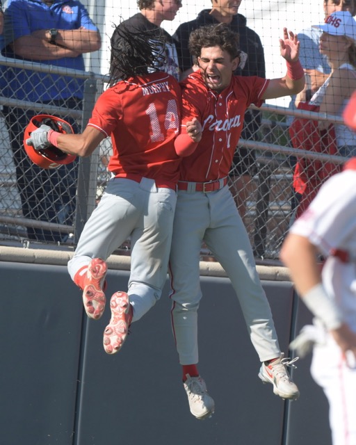 Featured Photos 5-10-24. Corona's Anthony Murphy, left, celebrates his game-tying home run Tuesday with teammate Trey Ebel at Santa Ana Mater Dei. Corona won the CIF Div. 1 second-round playoff game, 3-1, with two runs in the eighth. Corona plays at San Bernardino Aquinas today, Friday. Credit: Photo by Jerry Soifer