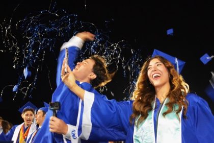 Norco High’s Ashley Gonzalez (right) captures a selfie as caps and confetti fly at the end of the Norco Class of 2024 Commencement Ceremony.