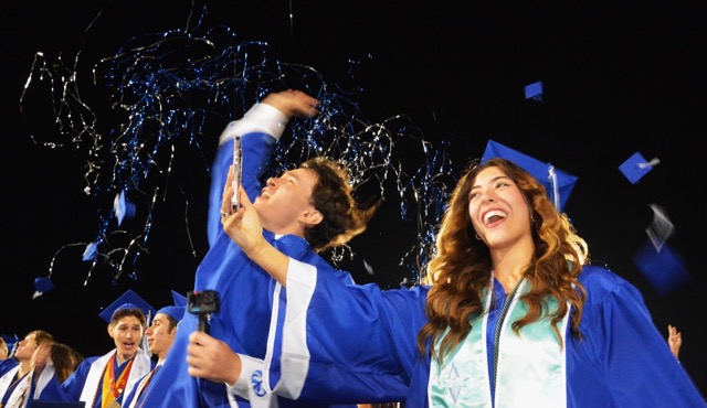 Norco High’s Ashley Gonzalez (right) captures a selfie as caps and confetti fly at the end of the Norco Class of 2024 Commencement Ceremony.