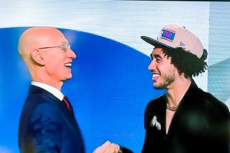 Jard McCain. : NBA Commissioner Adam Silver and Jared Share smiles after Silver announed McCain as the 16th pick in the draft.
