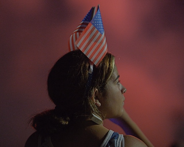 For More Featured Featured Photos 7-12-24. Autumn Brown, 11, is illuminated by July 4th fireworks at Santana Regional Park in Corona Thursday. Credit: Photo by Jerry Soifer. More Photos on Page 10.