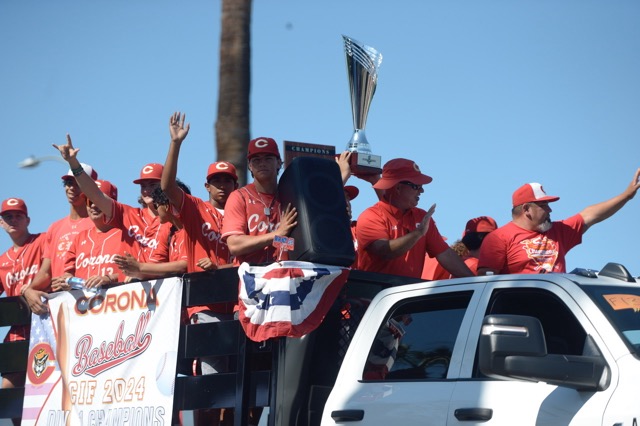 The Corona High School baseball team joined the Corona 4th of July Parade, holding with pride trophies they earned on the way to capturing the CIFSS Division I title, and ranked 3rd nationally. Credit: Photo by Jerry Soifer