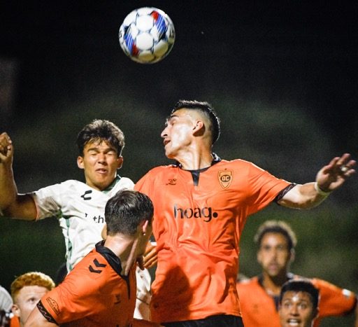 Orange County Soccer Club’s Cameron Dunbar (7) goes for a header against Oakland in a USL game Saturday at Great Park in Irvine. Oakland won, 2-0. Credit: Photo by Jerry Soifer