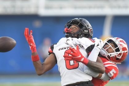 Photo by Jerry Soifer Corona Centennial's Cory Butler Jr. has a pass get away under pressure from Mater Dei's Darius DIxson.