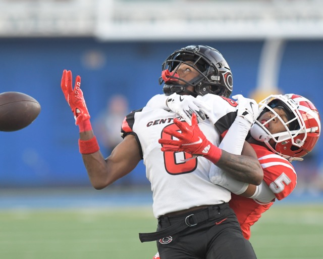 Photo by Jerry Soifer Corona Centennial's Cory Butler Jr. has a pass get away under pressure from Mater Dei's Darius DIxson.