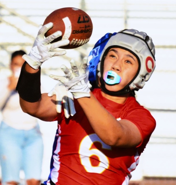 Corona’s Ava Liaga (6) hauls in a pass in front of a Norco defender in the Panther’s 13 – 7 victory over the Cougars, in a rematch of last season’s championship game, also won by Corona.
Credit: Photo by Gary Evans
