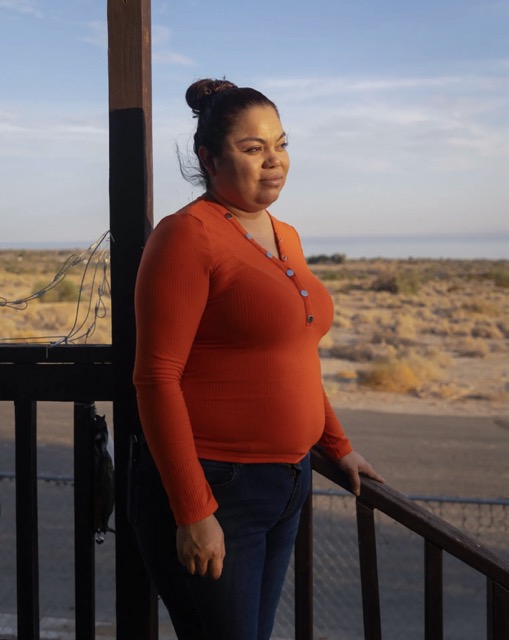 Danger in the Dust: Coachella Valley Residents Struggle to Breathe. Sara Renteria, who suffers from asthma, stands on the porch of her home in North Shore, on July 17, 2024. Credit: Photo by Zoë Meyers for CalMatters