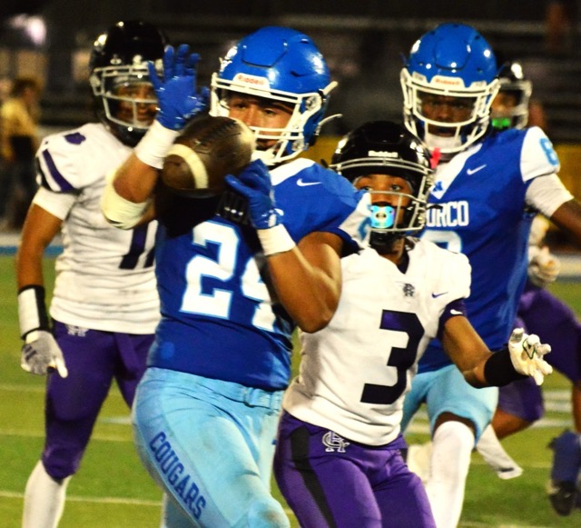 Norco’s Maddox Barrios (24) cuts in front of Rancho Cucamonga’s Tyree Wilson (3) for an interception that led to a first-half-ending field goal. The Cougars fought back from a 21-3 deficit, to take a late 25-24 lead. Rancho returned the ensuing kickoff for a touchdown, prevailing 30-25.