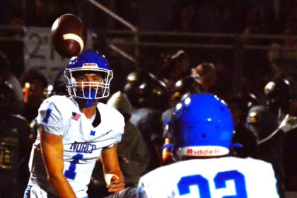 Featured Photos 9-27-24 . Norco quarterback Joseph Stoffel (1) flips a pass over a Citrus Valley defender to Trevor Schneider (22) during the Cougars 17 – 10 win over the Blackhawks. Credit: Photo by Gary Evans