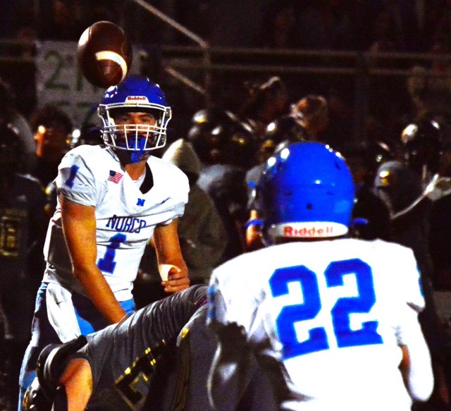 Featured Photos 9-27-24 . Norco quarterback Joseph Stoffel (1) flips a pass over a Citrus Valley defender to Trevor Schneider (22) during the Cougars 17 – 10 win over the Blackhawks. Credit: Photo by Gary Evans