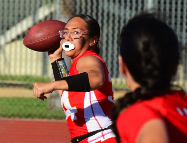 Corona Quarterback Feli Solomua eyes her receiver during their game against Aliso Niguel.