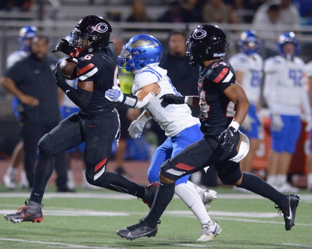 Corona Centennial defensive back Jayden Walk-Green makes an interception against Santa Margarita in a non-league game at Centennial.  