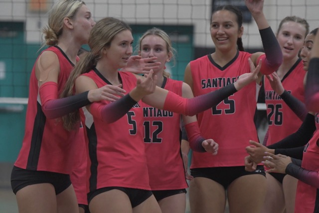 The Corona Santiago girls’ volleyball team celebrates its 3-0 win over visiting Riverside King in a Big VIII League game on Tuesday. Credit: Photo by Jerry Soifer