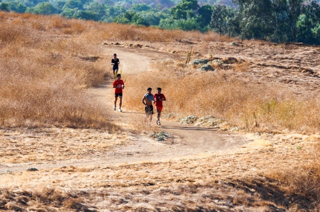 Student Athletes. Students run along a bike path outside of Norte Vista High School in Riverside on Sept. 19, 2024. 
Credit: Photo by Carlin Stiehl for CalMatters
