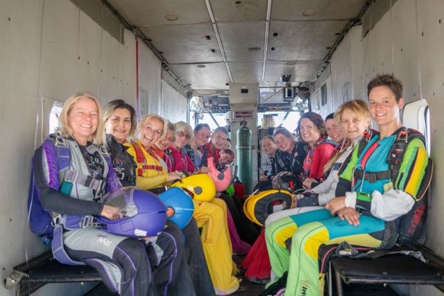 With nerves of steel, these women are all smiles pre jump. Credit: Carl Schwenk