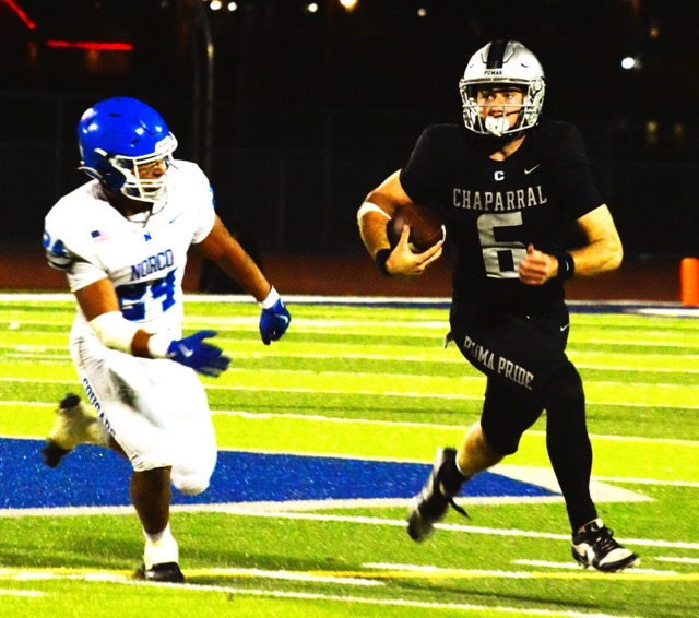 Norco’s Maddox Barrios (24) chases after Temecula Chapparal’s QB Dane Weber (6) in the second half of the Pumas 48 – 37 victory over the Cougars. 
Credit: Photo by Gary Evans
