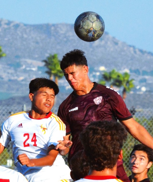 College of the Desert’s Cardiel Rivera-Meza (24) and Norco College’s Tommy Castaneda (Center) battle for a corner kick in the crease.  Castaneda’s header bounced off the cross bar, and enabled teammate Yuya Oikawa to score on a header of his own. 
Credit: Photo by Gary Evans
