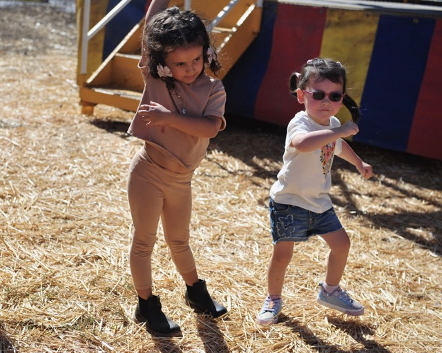 Amira, 4, and her sister Mila, 3, Abdulla, of Riverside, dance at a Halloween pumpkin patch on El Sobrante Road in Corona.
Credit: Photo by Jerry Soifer
