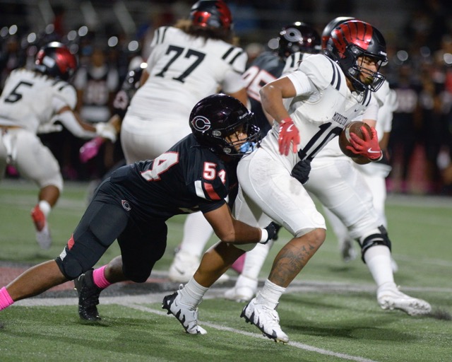 Centennial linebacker Fifita Tauteoli-Moore tackles Murrieta Valley's Kurelle Thomas in a Big West Conference game Friday at Centennial. Centennial won, 28-9.