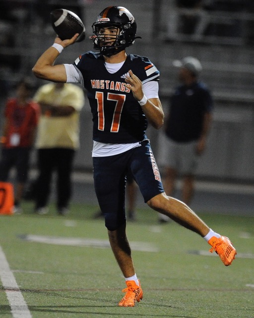 Eleanor Roosevelt quarterback Matthew Patino has some room as he eyes a receiver. Credit: Photo by Jerry Soifer