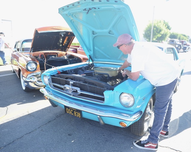 Steve Erwin, of Anaheim, employs the juice from his Chevrolet Bel Air to jump-start the 1964 Ford Mustang of his friend, Keith Otte, of Garden Grove. Last Saturdays car and bike show was the 8th Annual Boudreau Pipeline Charity Event in Corona, which raised $81,000 for two charities, Friends of Leaps and Bounds and the Autism Society of Inland Empire.