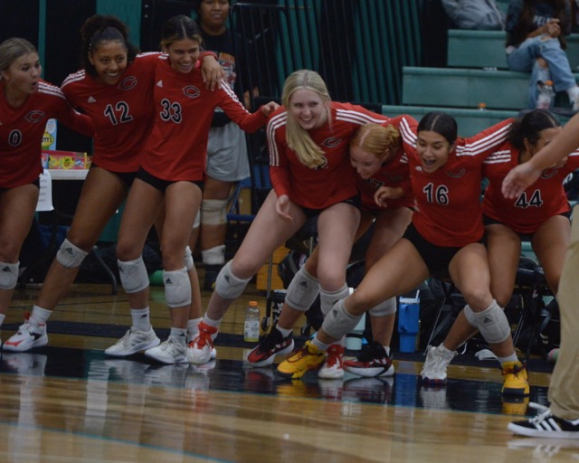 Corona Centennial volleyball players celebrate as they near end of 3-0 win at Corona Santiago Tuesday.
Credit: Photo by Jerry Soifer
