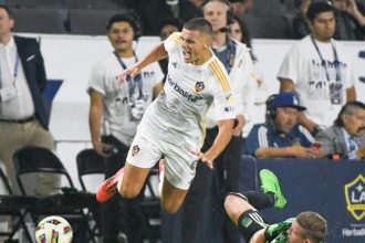 The LA Galaxy's Dejan Joveljic who scored the game-winning goal to defeat Austin FC Saturday goes airborne late in the MLS game Saturday at the Dignity Health Sports Park in Carson. The Galaxy won, 2-1. Credit: Photo by Jerry Soifer