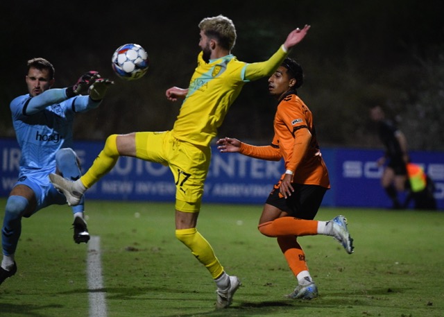 Featured Photos 10-25-2024. Orange County Soccer Club goalie Colin Shutler blocks a scoring attempt by New Mexico United's Greg Hurst as OCSC midfielder Ashish Chattha comes up on the play in a USL game at Great Park in Irvine last Saturday. The teams played to a scoreless tie. OCSC concludes its regular season with a Saturday night game at Great Park against visiting Hartford Athletic. Credit: Photo by Jerry Soifer