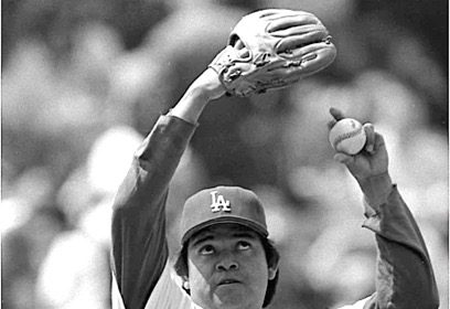 Fernando Valenzuela in 1986 exhibiting his famed windup, his arms, and eyes rolled up to the heavens, about to deliver his legendary screwball. Credit: Tony Barnard, Los Angeles Times via UCLA Archive