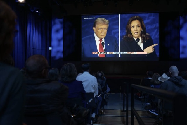 People watch the presidential debate between former President Donald Trump and Vice President Kamala Harris at the KQED headquarters in San Francisco on Sept. 10, 2024. Photo by Florence Middleton, CalMatters