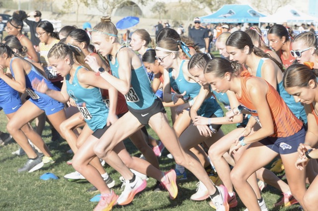 Corona Santiago senior Rylee Blade, middle, is off with starters gun in the Big VIII League cross country final at Eastvale Community Park Friday. She quickly separated from the pack winning the three-mile race with a time of 15:23.7. Panther teammate Audrey Buckley was runner-up, conquering the course in 17:24.2. Photo by Jerry Soifer