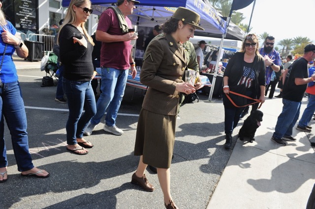 Carlie Holland sports a World War II U.S. Army women's uniform Saturday at the Amber Waves of Grain salute to veterans at the Dos Lagos shopping center in South Corona. Hundreds attended the event which included a parade and a craft beer festival, prior to Veterans Day this coming Monday.