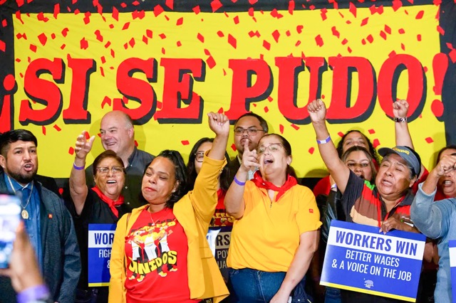 Prop. 32. Fast food workers cheer before Gov. Gavin Newsom signs legislation boosting wages to $20 an hour, starting in April, during a press conference at SEIU Local 721 in Los Angeles on Sept. 28, 2023. Credit: Photo by Alisha Jucevic for CalMatters