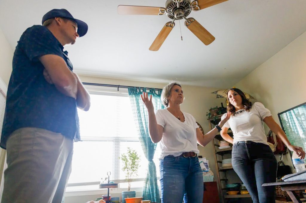 Affordable Housing in the Inland Empire. From left, housing advocates of Upward Community Aaron Cook, Laurel Lamont and Melissa Bourbonnais speak inside Lamont’s apartment in Temecula on Oct. 11, 2024. 
Credit: Photo by Kristian Carreon for CalMatters
