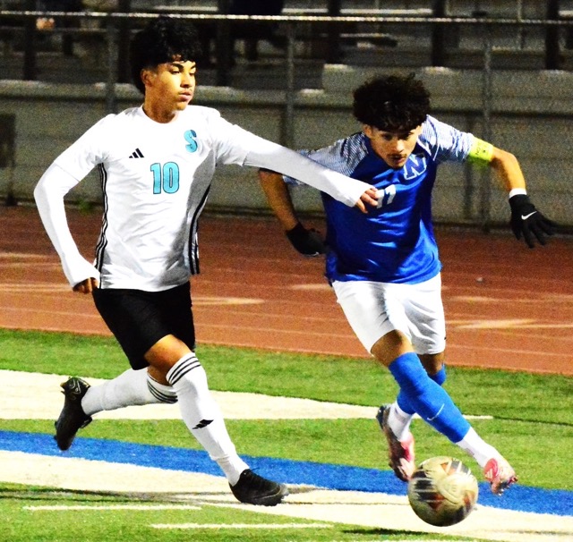 Sultana’s Ivan Vitela (10) tries to slow down Norco’s Abraham Garcia (11) during the Cougars 1 – 0 victory over the Sultans. Credit: Photo by Gary Evans