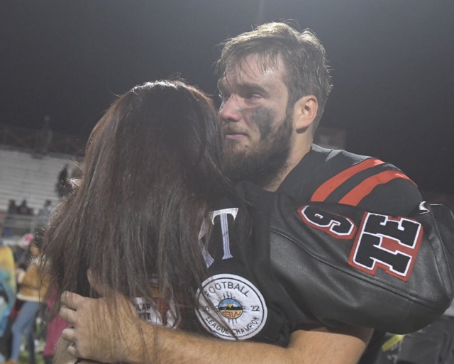 Murrieta Valley tight end Brandon Gilbert is comforted by his mother, Sarah. Photo by Jerry Soifer