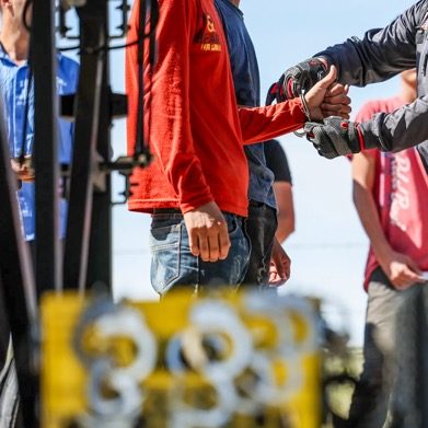 Migrants wait to receive toiletry items at Moviemiento Juventud 2000 in Tijuana on July 26, 2023. Credit: Photo by Adriana Heldiz, CalMatters