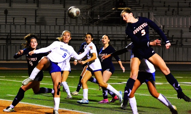 Featured Photos 01-24-2025. Eastvale Roosevelt’s Emma Gause (8) watches a corner kick come in the crease as Norco’s Briana Sousa (9) winds up to clear the ball after Brooklyn Musser (3) missed the header on goal. The Cougars scored in the first half, the Mustangs scored in the second, both teams battled to a 1-all tie. In the background, Norco’s Ashley Canales (center) and Roosevelt’s Delilah Woods (7) watch the play.