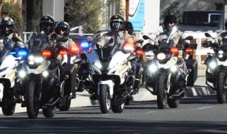 A Riverside County Sheriff Motorcycle Honor Guard leads the hearse  bearing escorting the remains of fallen motor Deputy Timothy Corlew.  Corlew died on Wednesday, January 8th when he struck a vehicle on the 91 Freeway near the La Sierra overpass on his way into Norco.  