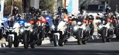 A Riverside County Sheriff Motorcycle Honor Guard leads the hearse  bearing escorting the remains of fallen motor Deputy Timothy Corlew.  Corlew died on Wednesday, January 8th when he struck a vehicle on the 91 Freeway near the La Sierra overpass on his way into Norco.  