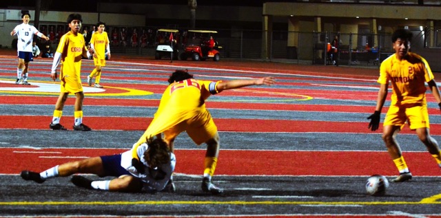 Eastvale Roosevelt’s Sebatian Halzuet (on the pitch) has a handful of Corona’s Andrew Cortez’ (26) jersey. Roosevelt’s Caden Choi (13), and Corona’s Uriel Baz (14), Micah Bejarano (6), and Johan Trujillo (21) react to the non-call. The Panthers defeated the Mustangs 2 – 1