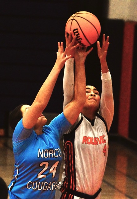 Norco’s Tiffany Montesinos (24) and Eastvale Roosevelt’s Makayla Haddock (4) battle for a rebound during the Mustangs 74 – 16 victory over the Cougars.
Credit: Photo by Gary Evans
